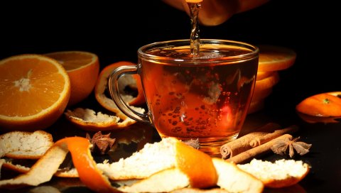 Черный фон, чай, чайные листья, оранжевый