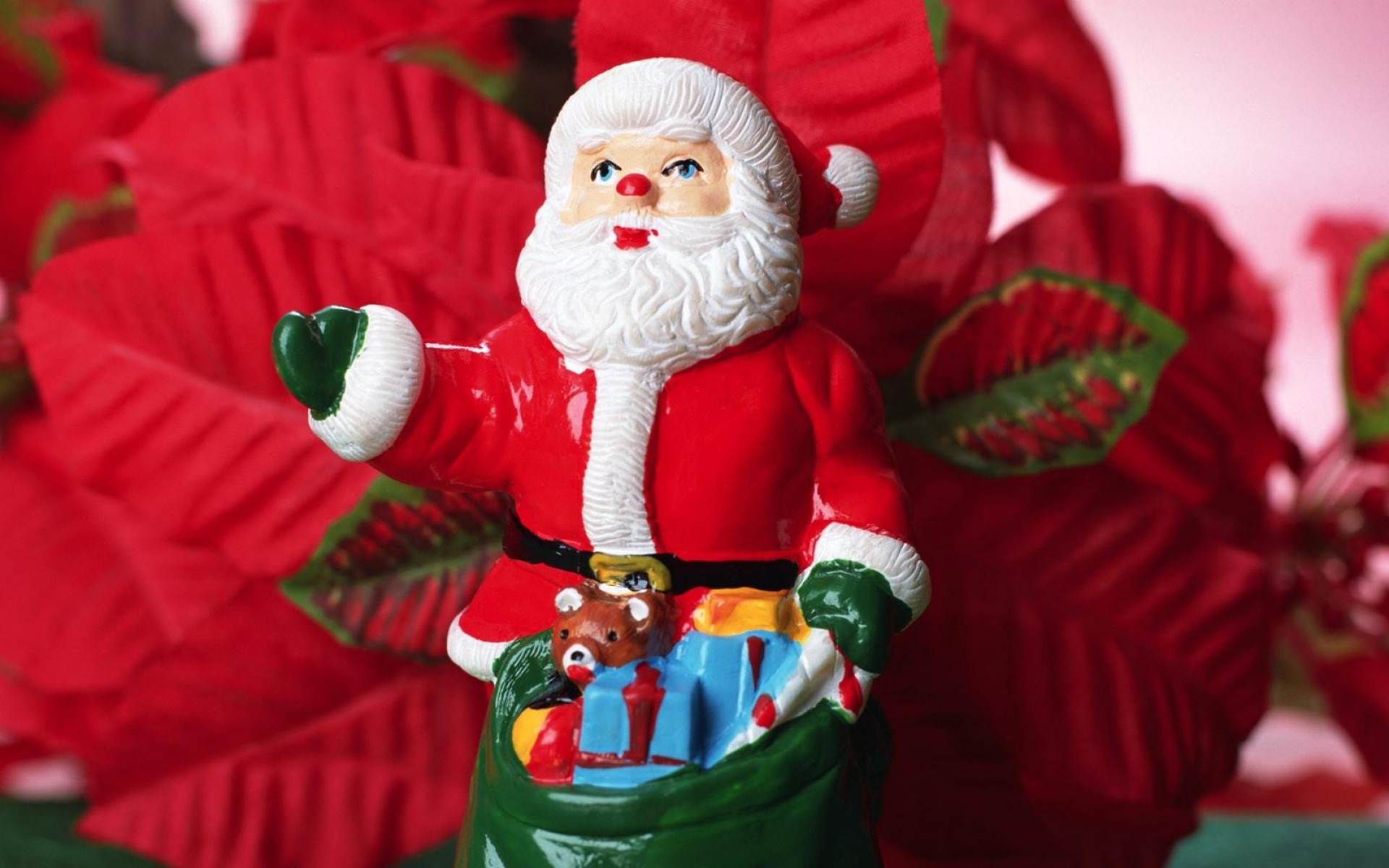 Картинки Санта-Клаус, рождество, игрушка, мешок, цветы фото и обои на рабочий стол