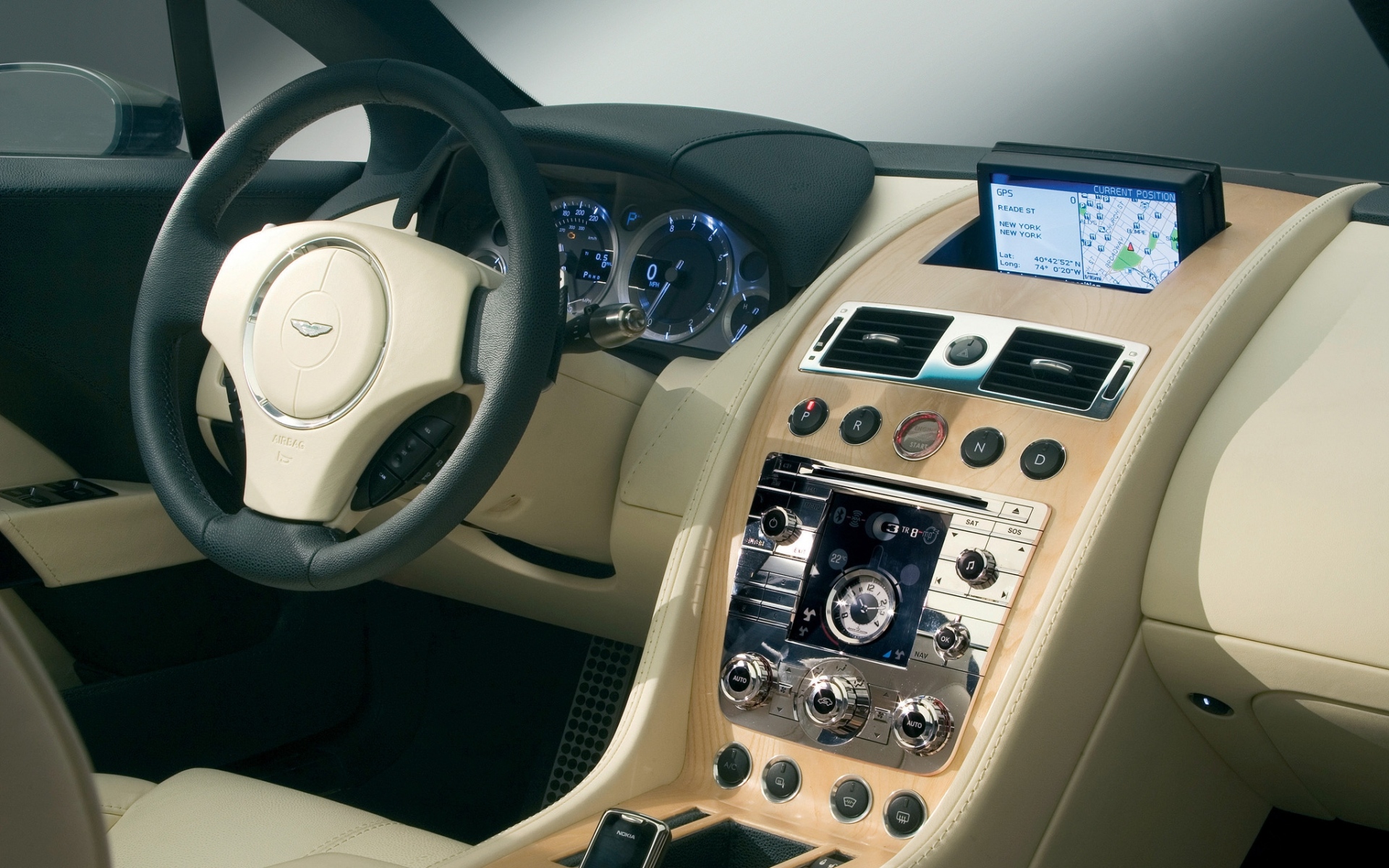 Картинки Aston martin, rapide, 2006, бежевый, салон, интерьер, концепт-кар, рулевое колесо, спидометр фото и обои на рабочий стол