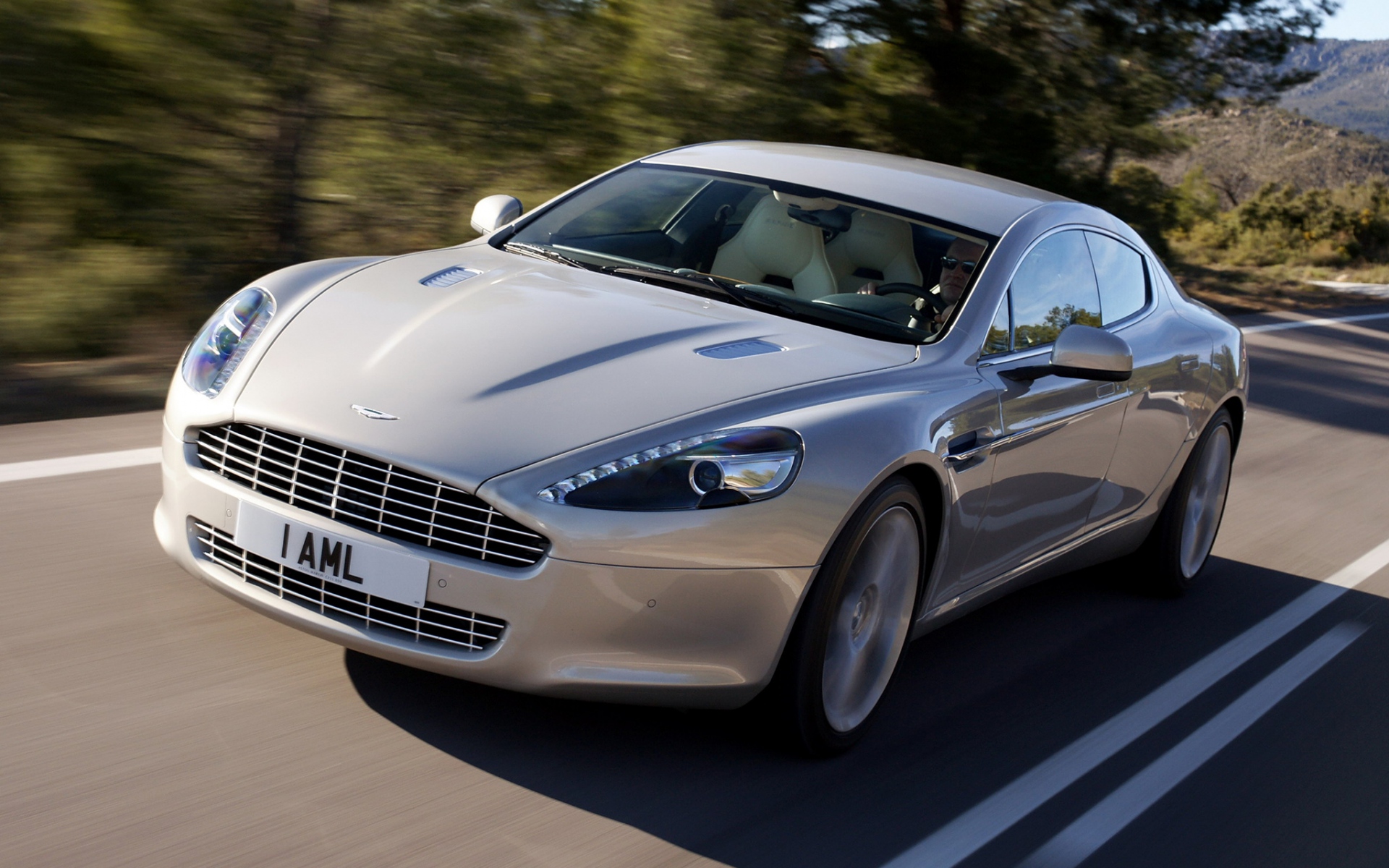 Картинки Aston martin, rapide, 2009, серебро, вид спереди, асфальт фото и обои на рабочий стол