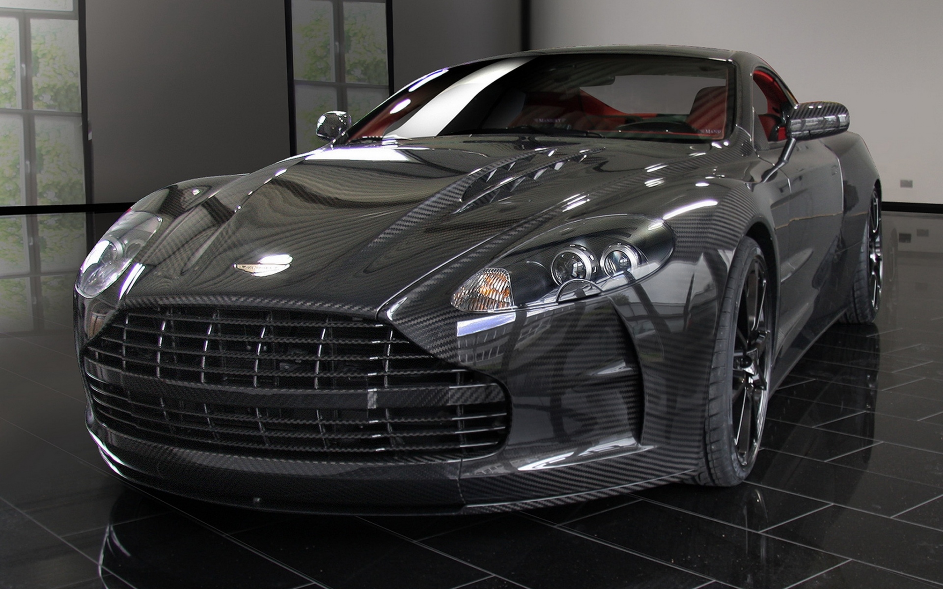 Картинки Mansory, aston martin, dbs, 2009, черный, вид спереди, стиль, отражение фото и обои на рабочий стол