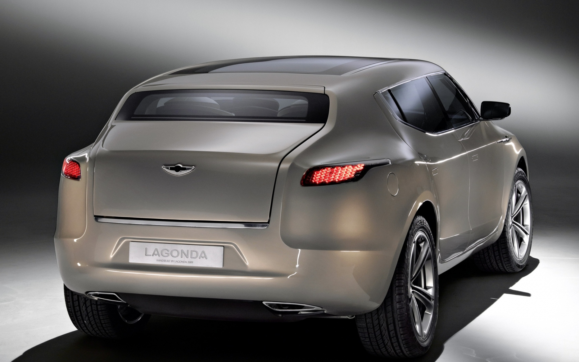 Картинки Aston martin, lagonda, 2009, бежевый металлик, вид сзади, концепт-кар, стиль фото и обои на рабочий стол