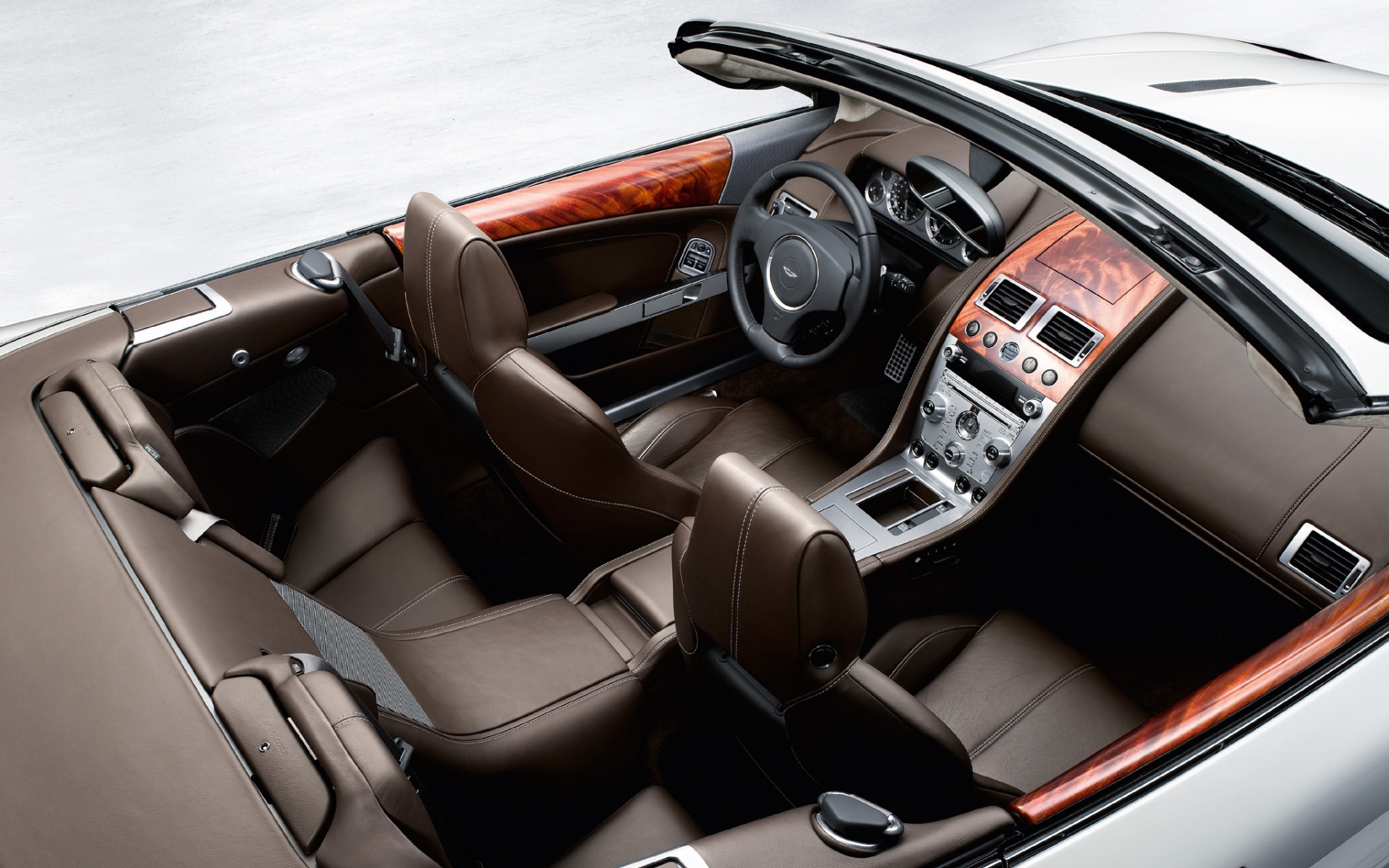 Картинки Aston martin, db9, 2008, коричневый, вид сверху, салон, салон, руль, спидометр фото и обои на рабочий стол