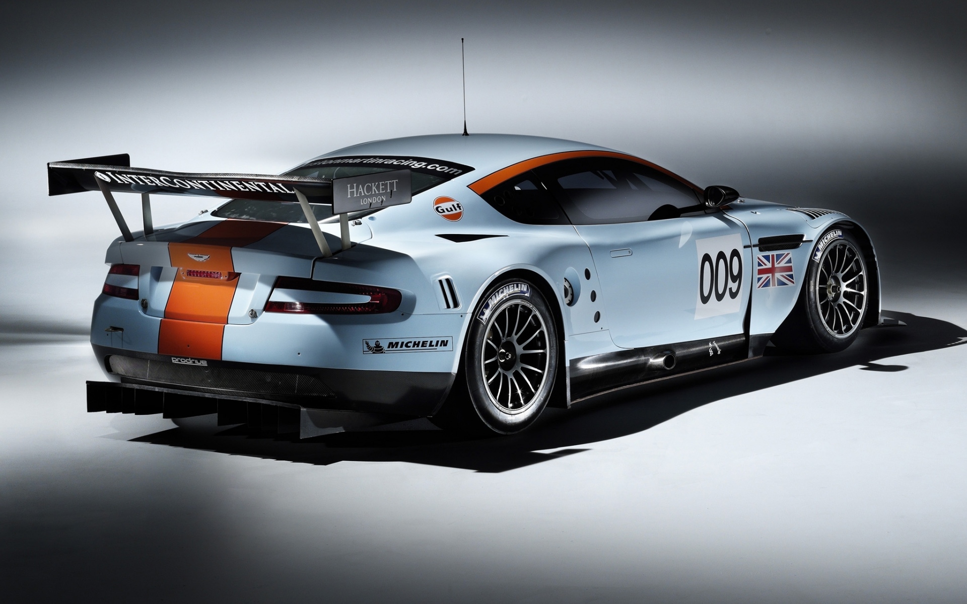 Картинки Aston martin, dbr9, 2008, белый, вид сзади, стиль, автомобили, спорт фото и обои на рабочий стол